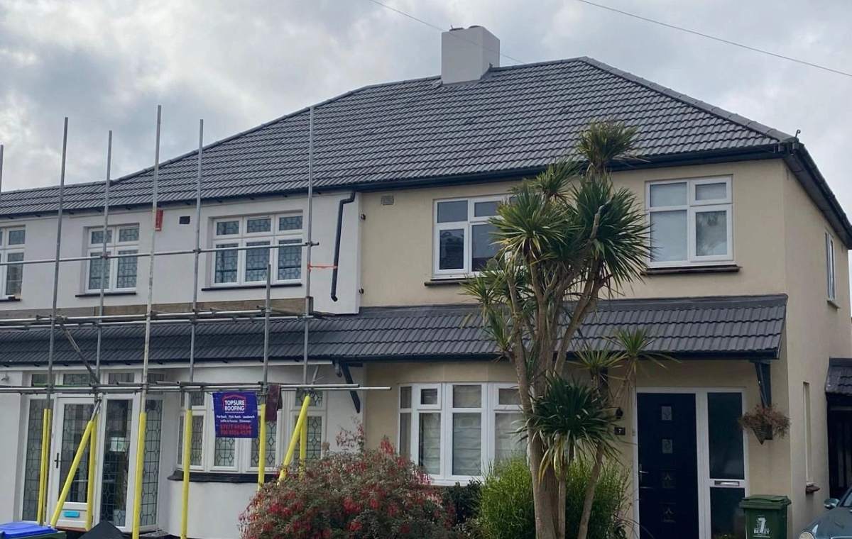 House in scaffolding during a Topsure re-roof