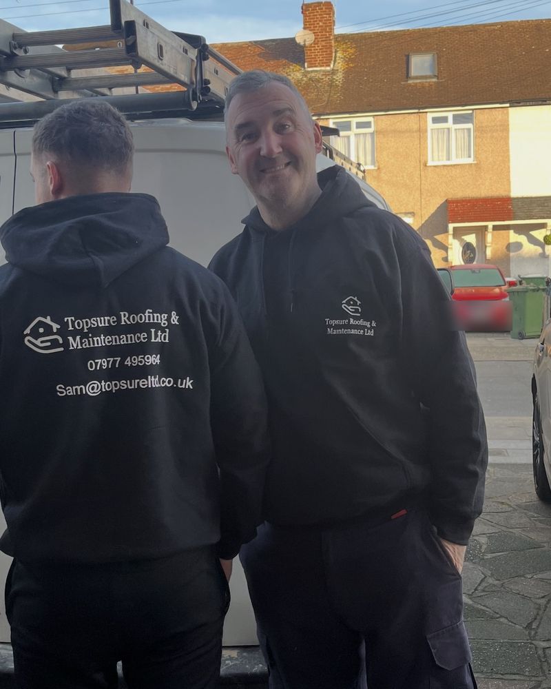 Sam McMath (right) with a member of the Topsure team beside the van